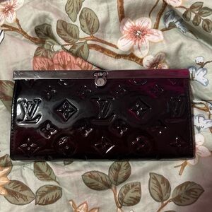 Louis Vuitton Black Wallet with Embossed Monogram Pattern